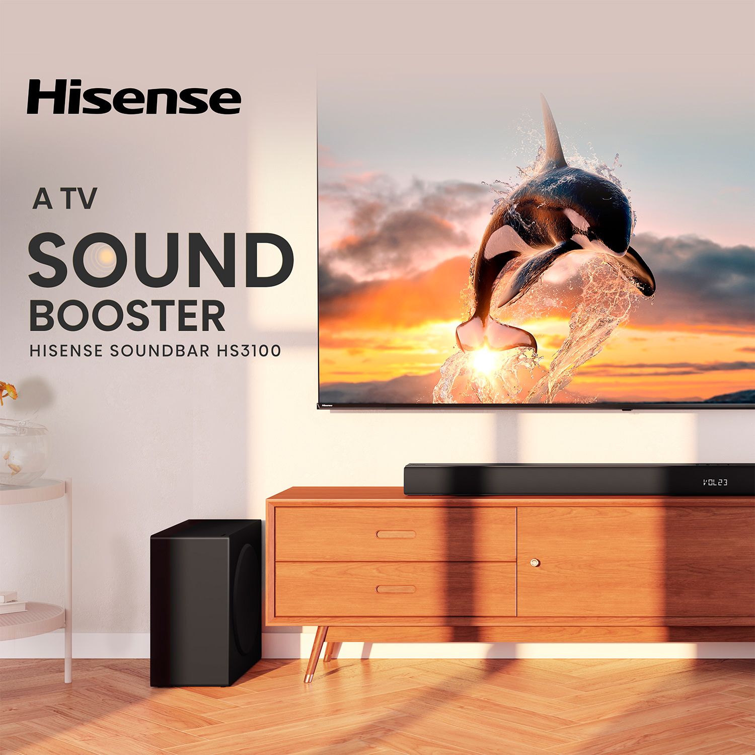 Salón con un televisor que muestra un delfín saltando. Barra de sonido y subwoofer visibles.