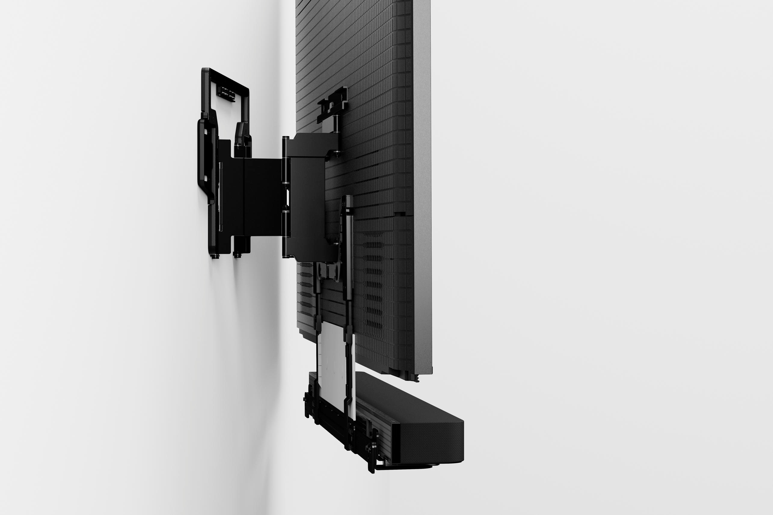 Schwarz, Wand-TV und Soundbar.