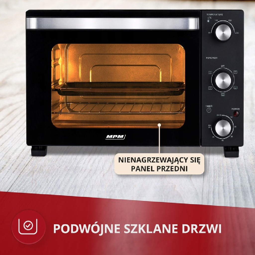 Czarny piekarnik z elementami sterującymi.