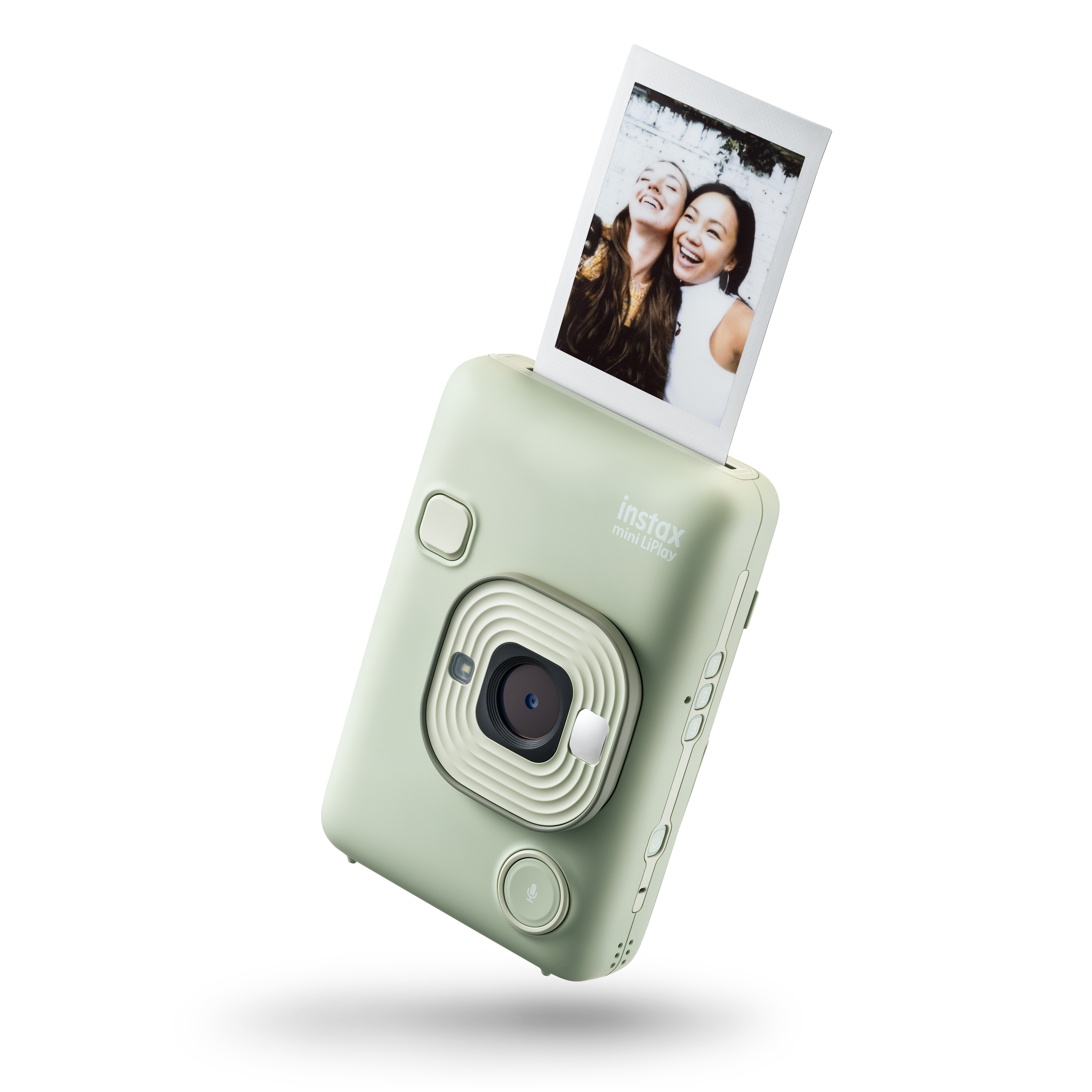 Grüne Instax Mini LiPlay Kamera. Druckt Foto, mit zwei lächelnden Frauen im Bild.