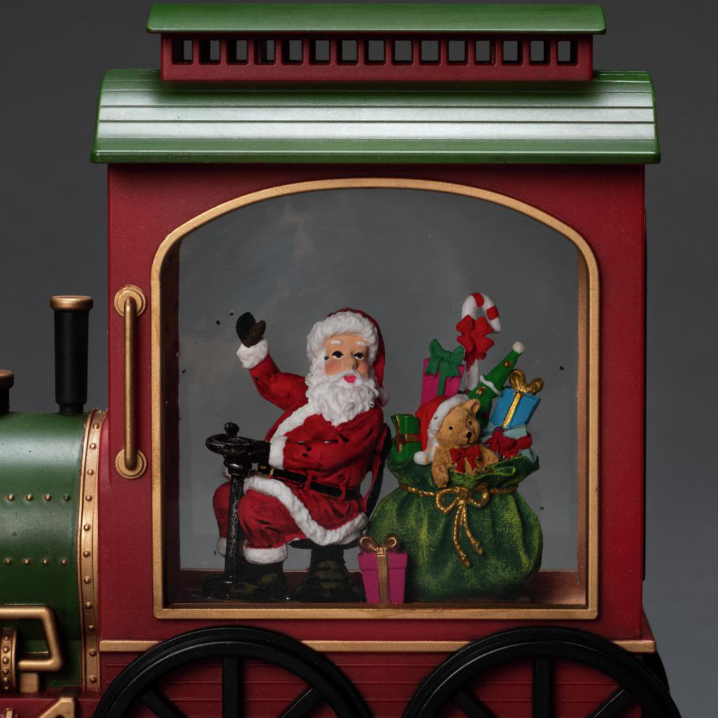 Weihnachtsmann in einem Zug. Der Zug ist rot und grün, mit Geschenken und Dekorationen.