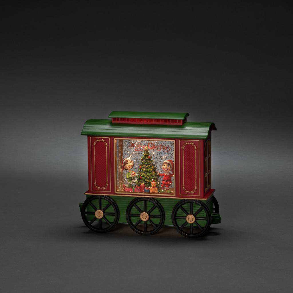 Eine Spielzeugeisenbahn mit Weihnachtsszene, mit Elfen und einem Weihnachtsbaum.