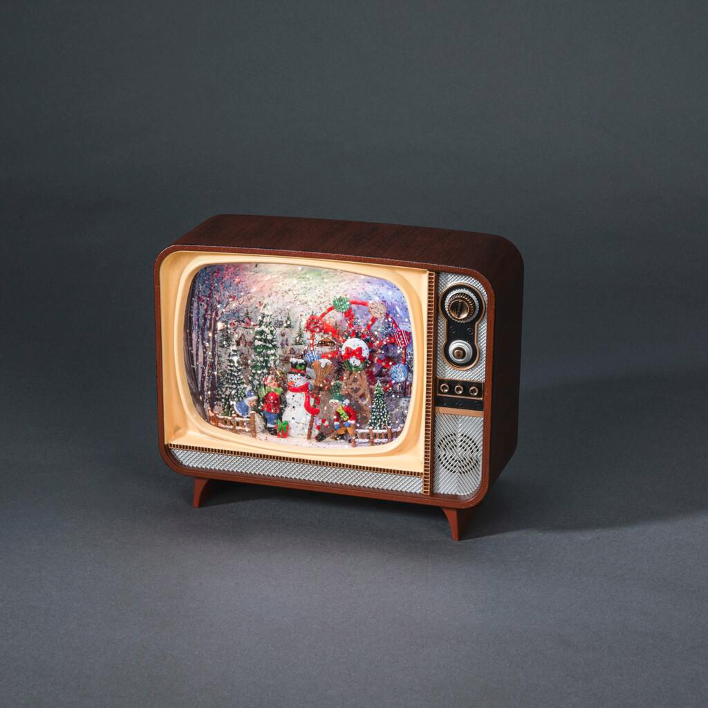 Eine Schneekugel in Form eines Vintage-Fernsehers mit einer Weihnachtsszene. Es zeigt Santa, Schnee und einen Winterwald.