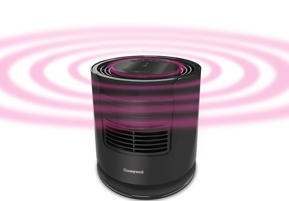Czarny oczyszczacz powietrza Honeywell z różowymi pierścieniami przepływu powietrza na białym tle.