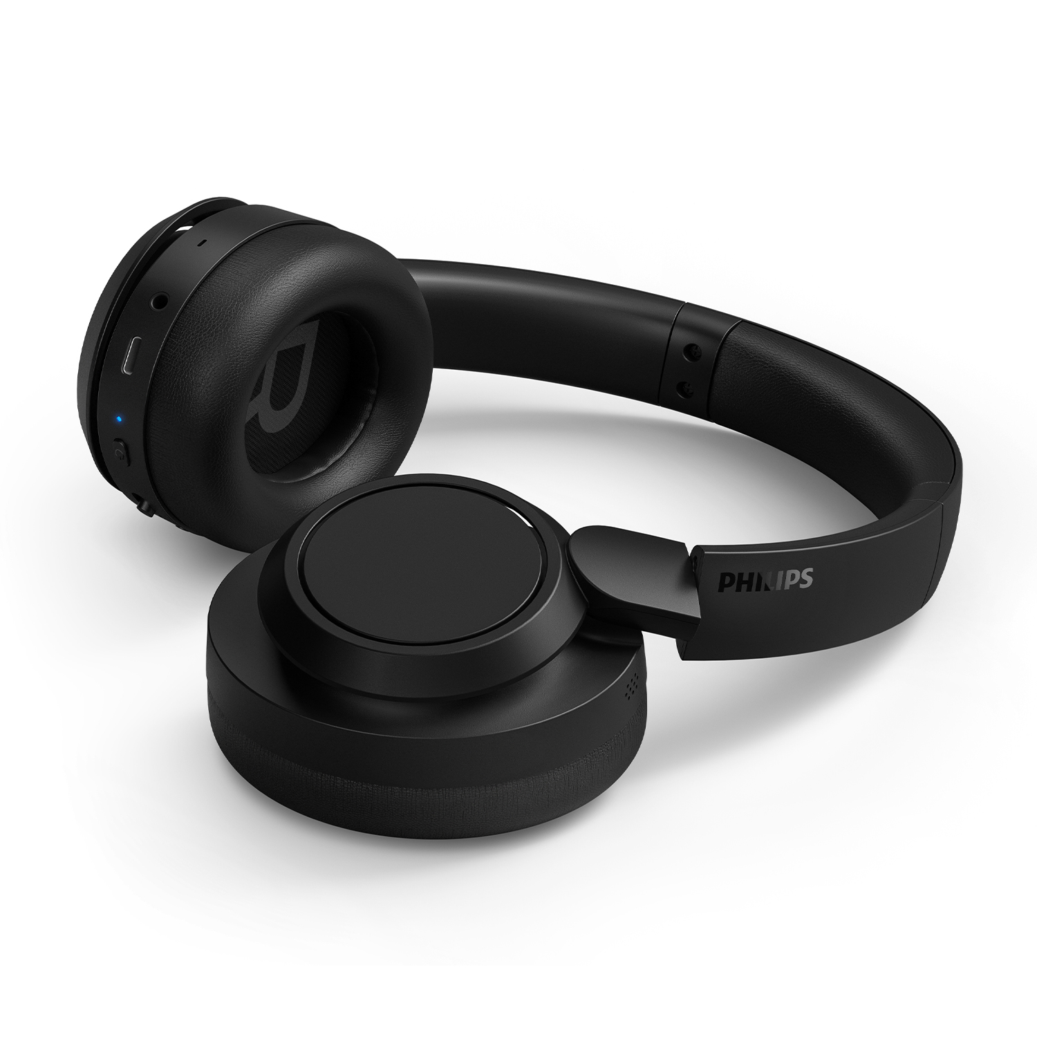 Cuffie nere su una superficie bianca. Logo Philips visibile.