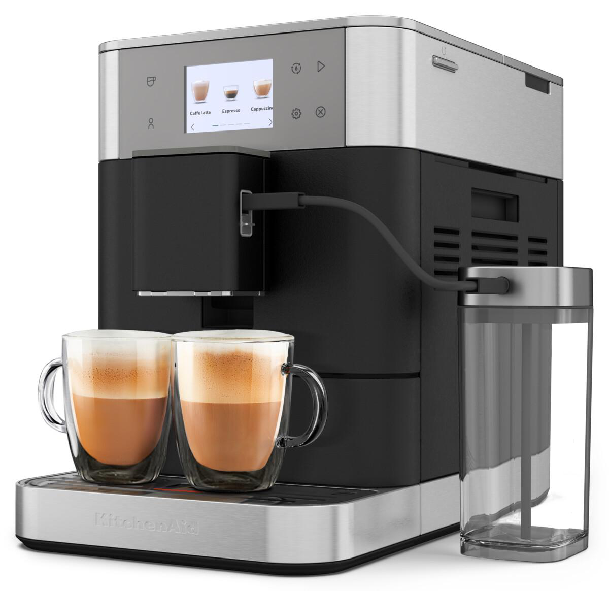 Eine schwarz-silberne Espressomaschine mit zwei Gläsern Kaffee.