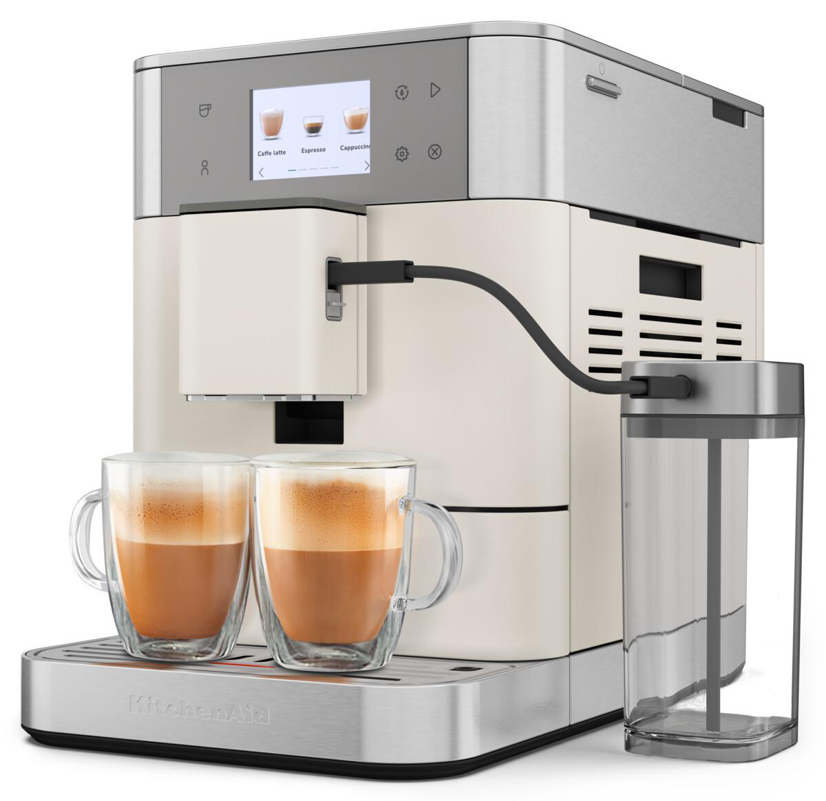Kaffeemaschine mit zwei Gläsern Kaffee und einem Wasserbehälter rechts.