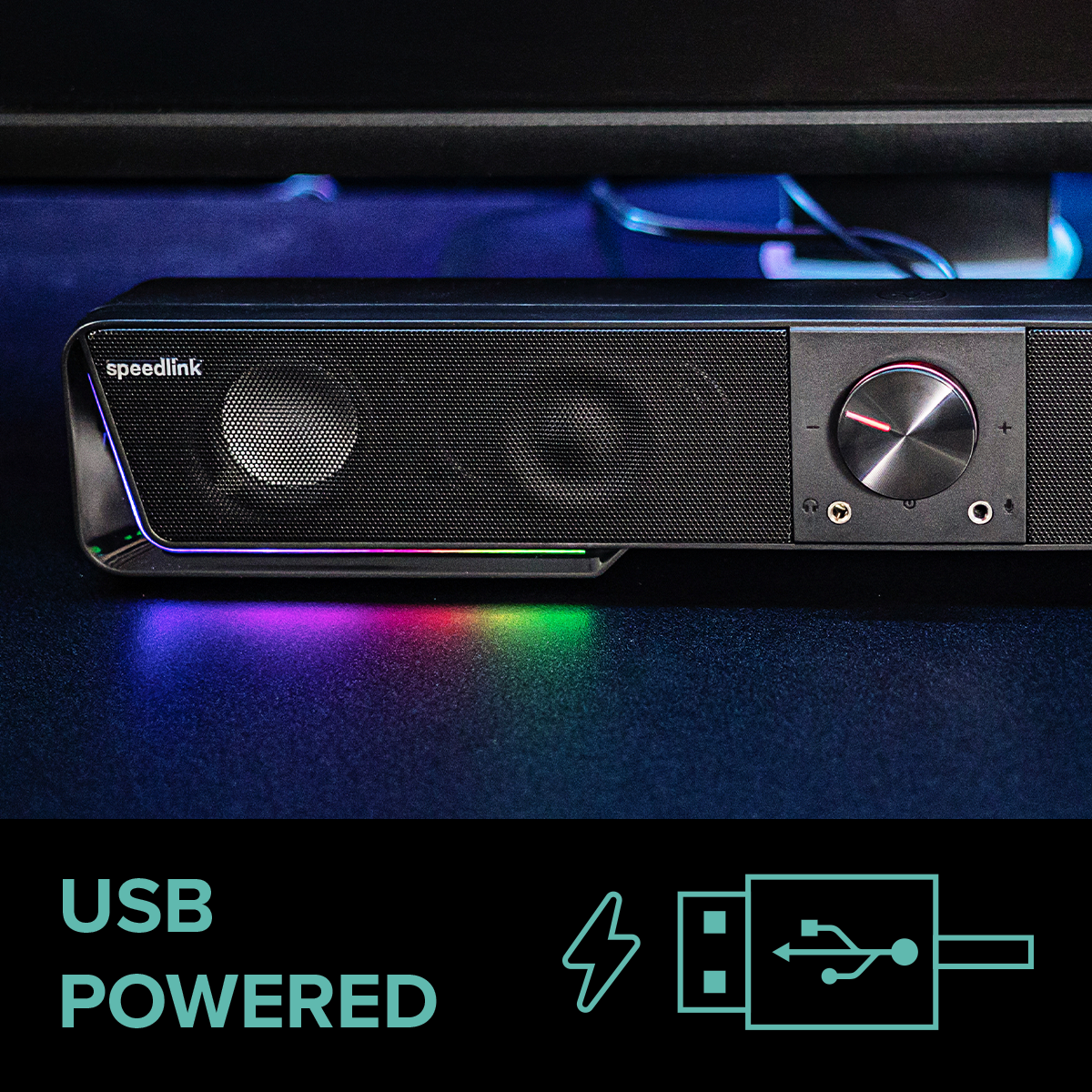 Schwarze Soundbar mit Gitter-Lautsprecherabdeckung, Lautstärkeregler und farbigen LED-Leuchten. USB-Grafik.