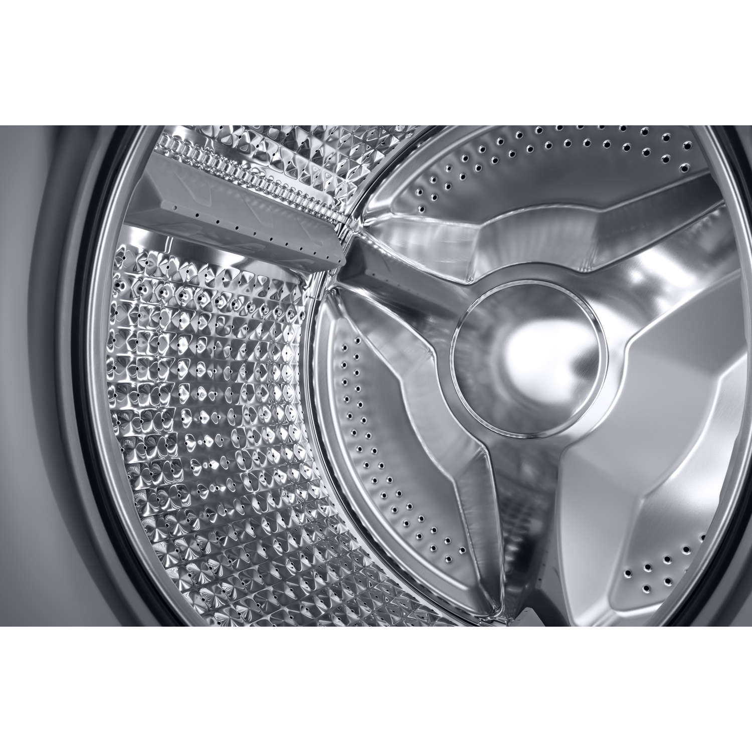 Close-up of a washing machine drum with a metallic, dimpled interior. Reflective surface.