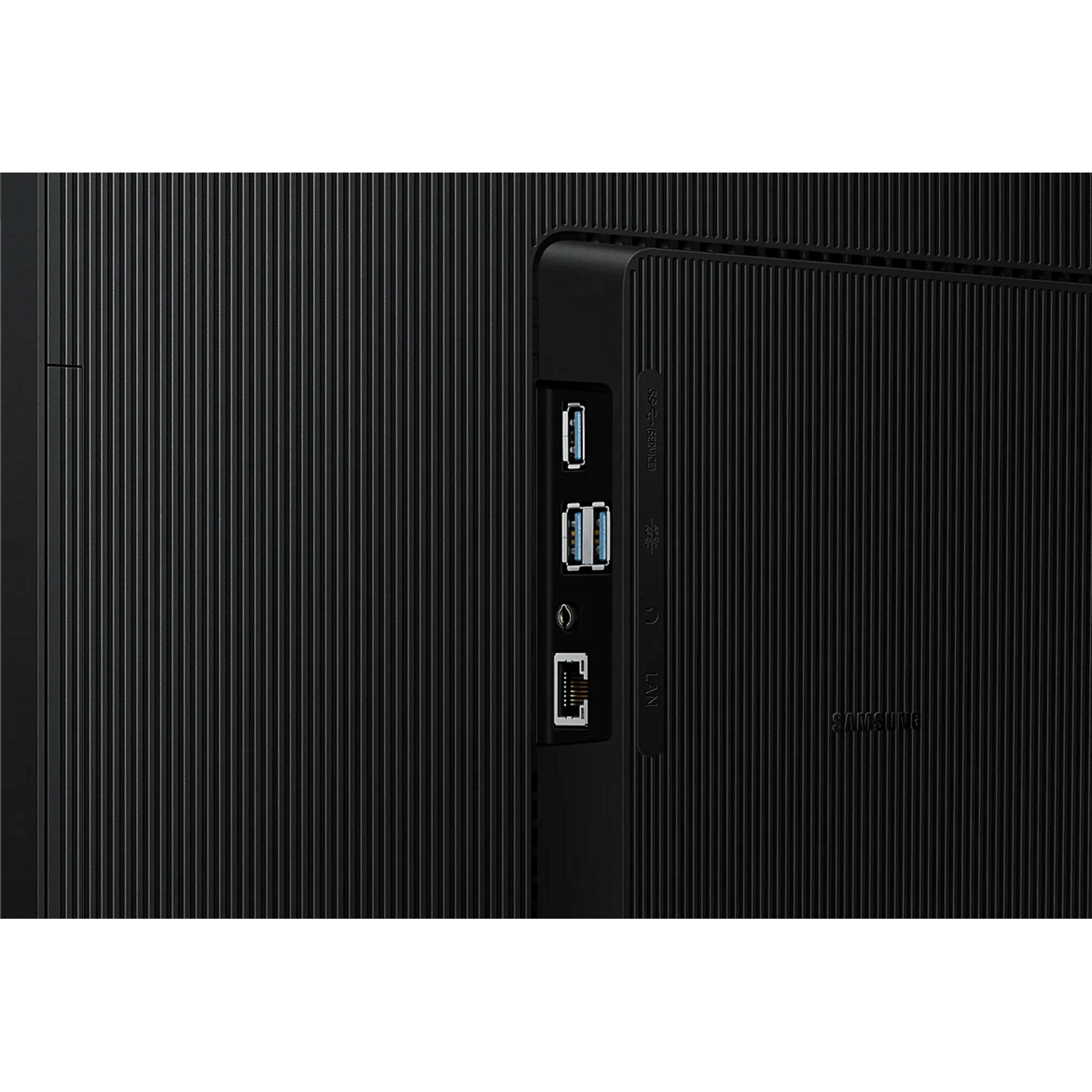 Close-up of the back of a black TV with USB, HDMI, and LAN ports visible.