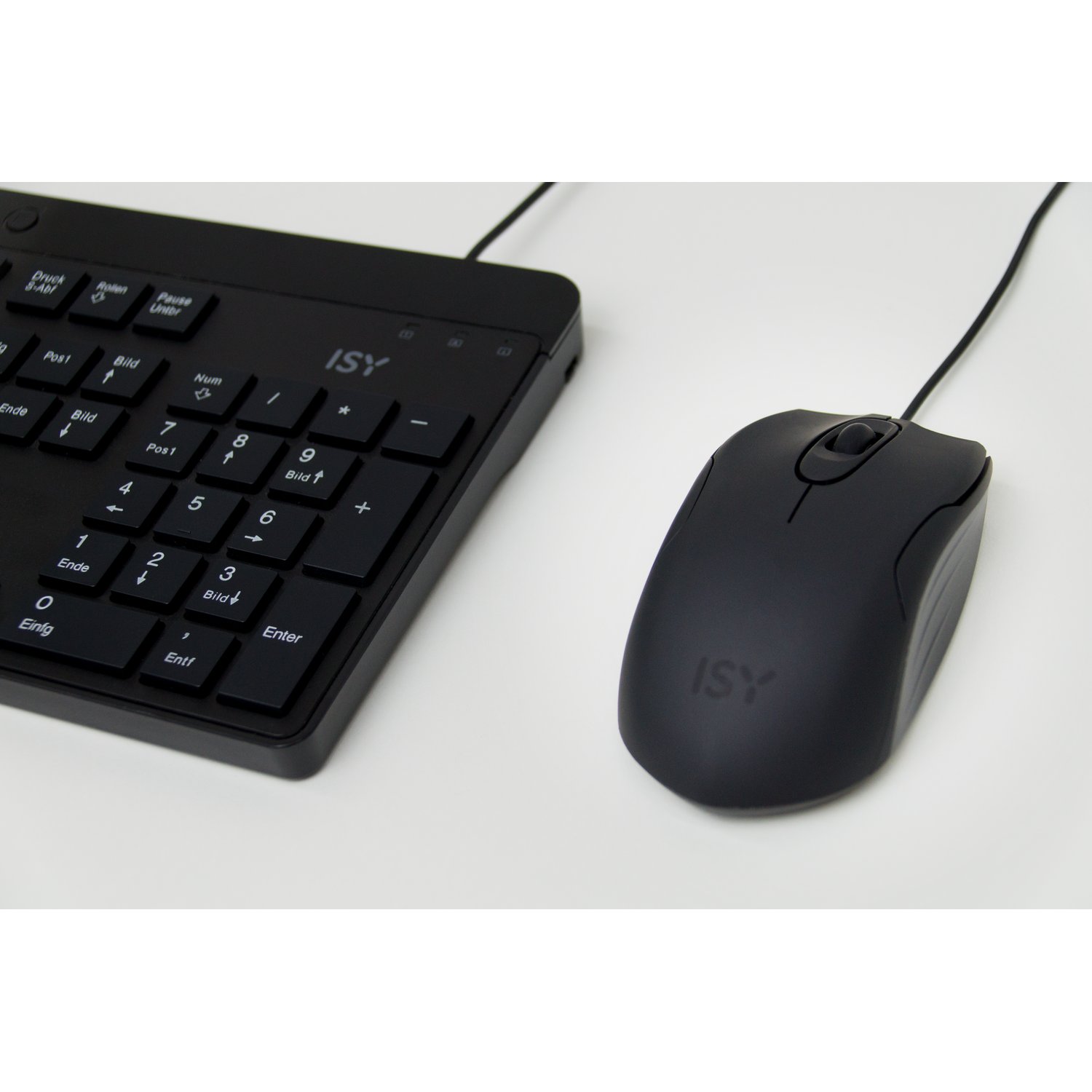 Black keyboard and mouse. Keyboard has a numeric keypad, mouse is to the right, on a white surface.