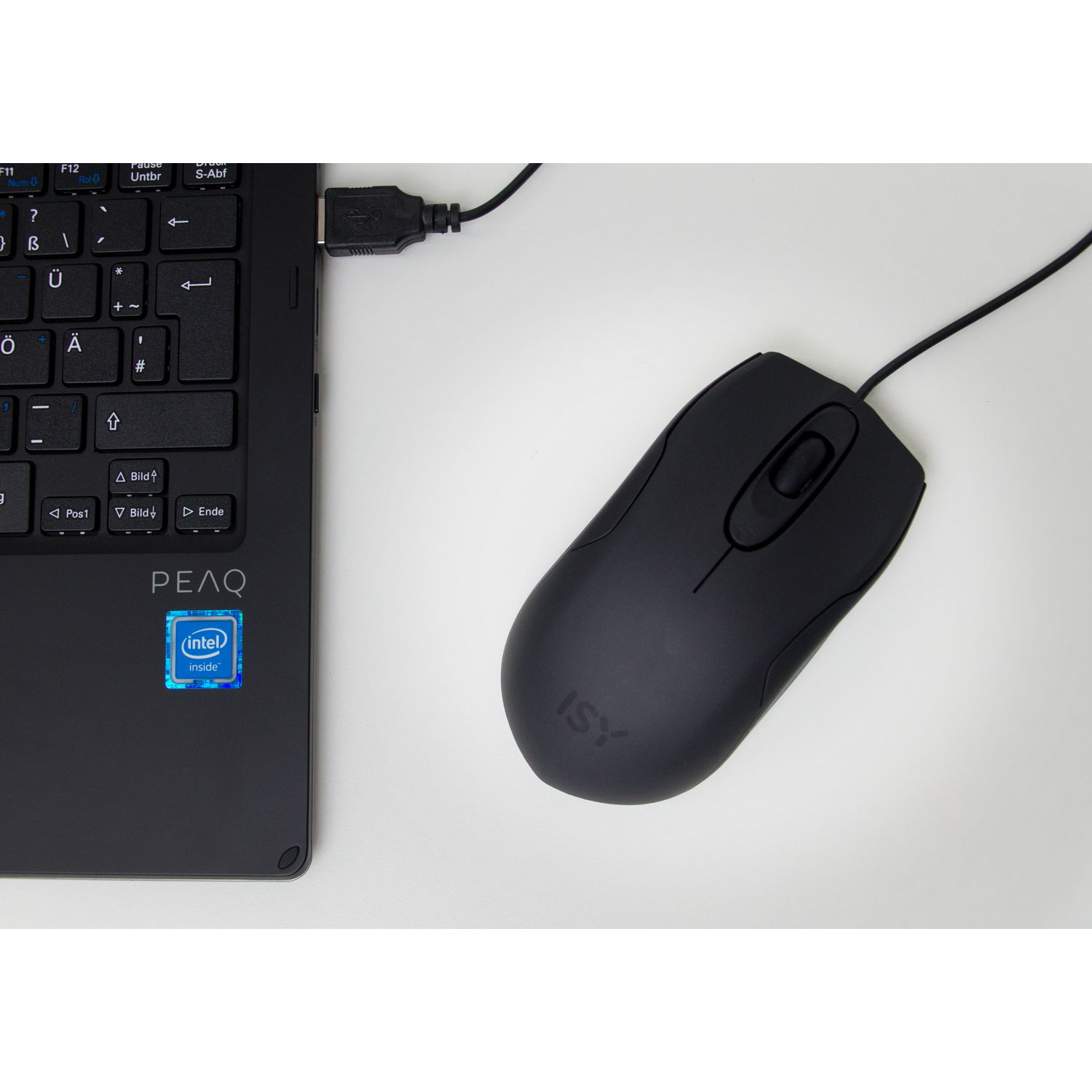 A black computer mouse and a laptop keyboard. A USB cable connects the mouse to the laptop.