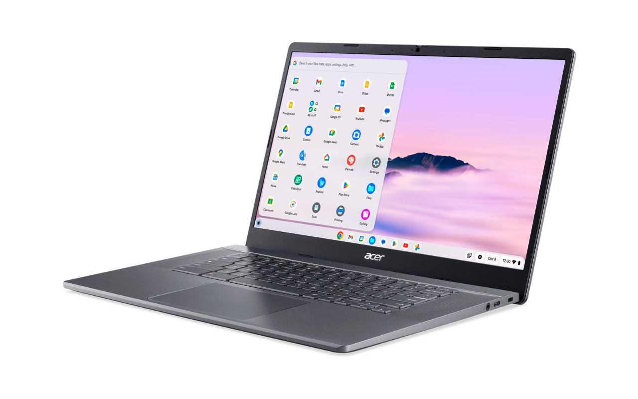 Silver laptop on a white background. The screen shows a Google apps menu.