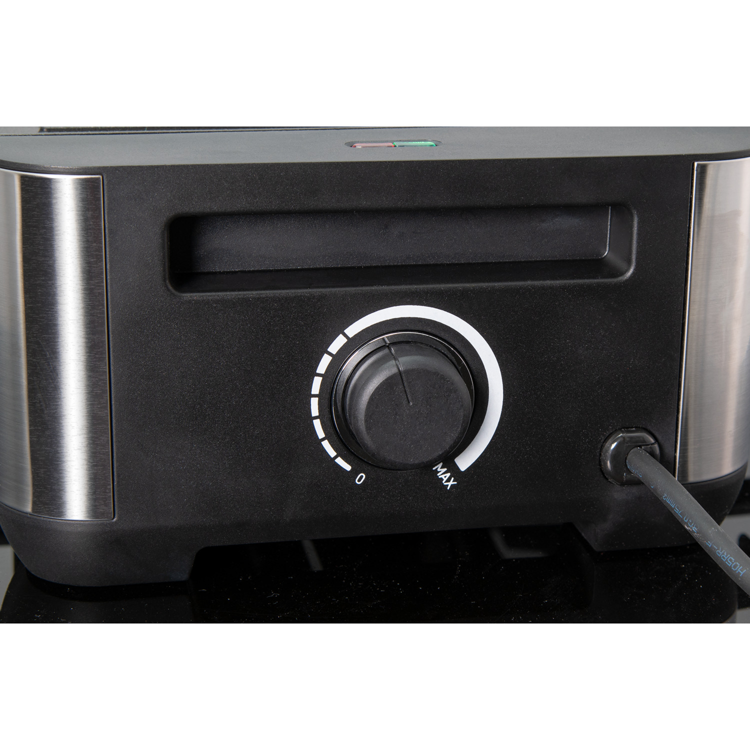 Black and silver toaster control panel with a dial from 0 to max.