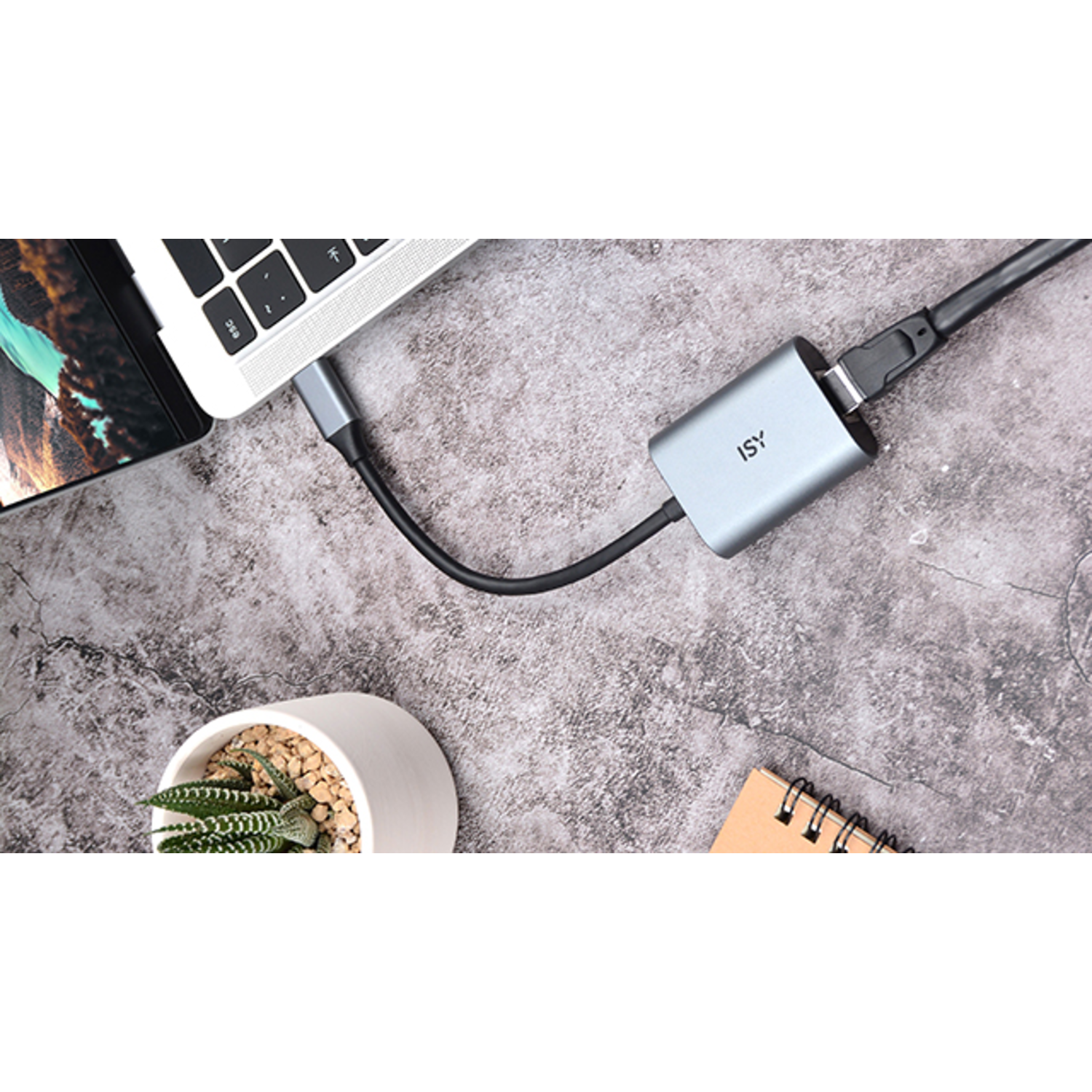 Laptop connected to a grey USB-C adapter with a black cable.