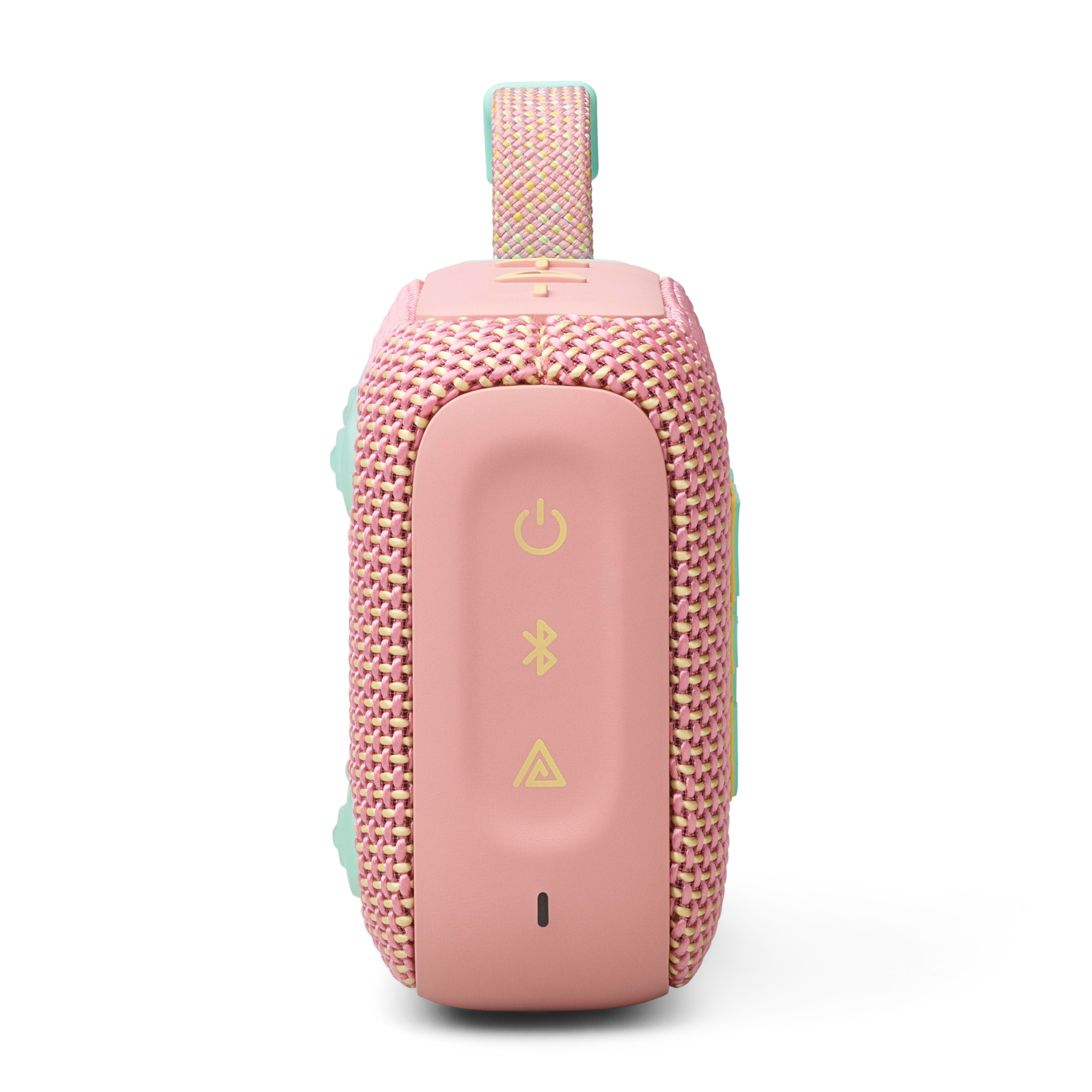 Ein kleiner, rosa-gelber Lautsprecher mit Griff. Es hat Knöpfe und ein Mesh-Design.