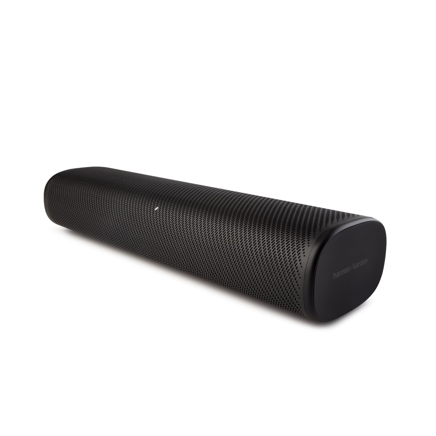 Een zwarte soundbar met een geperforeerd ontwerp. Het rust op een wit oppervlak.