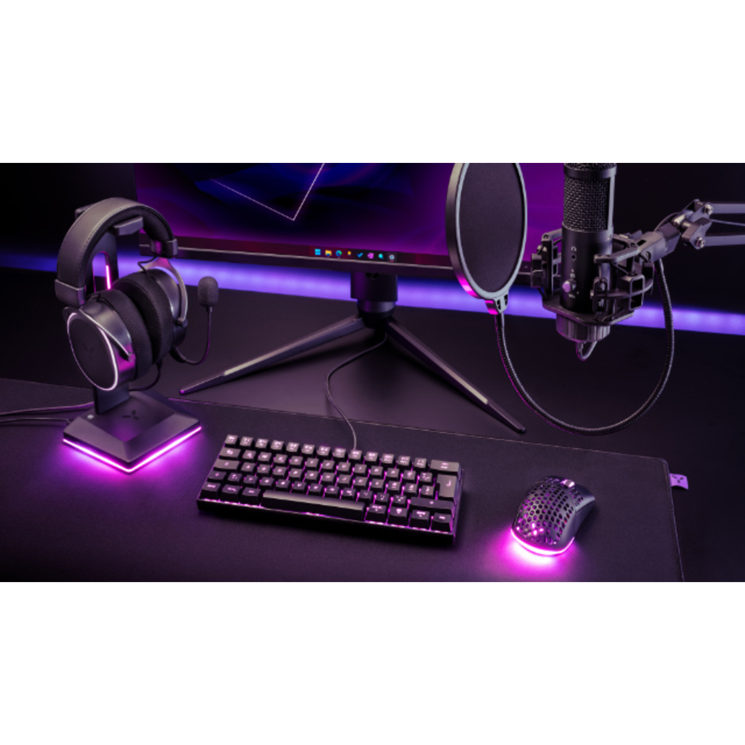 Gaming setup with headphones, keyboard, mouse, and monitor. All glowing with purple lights.
