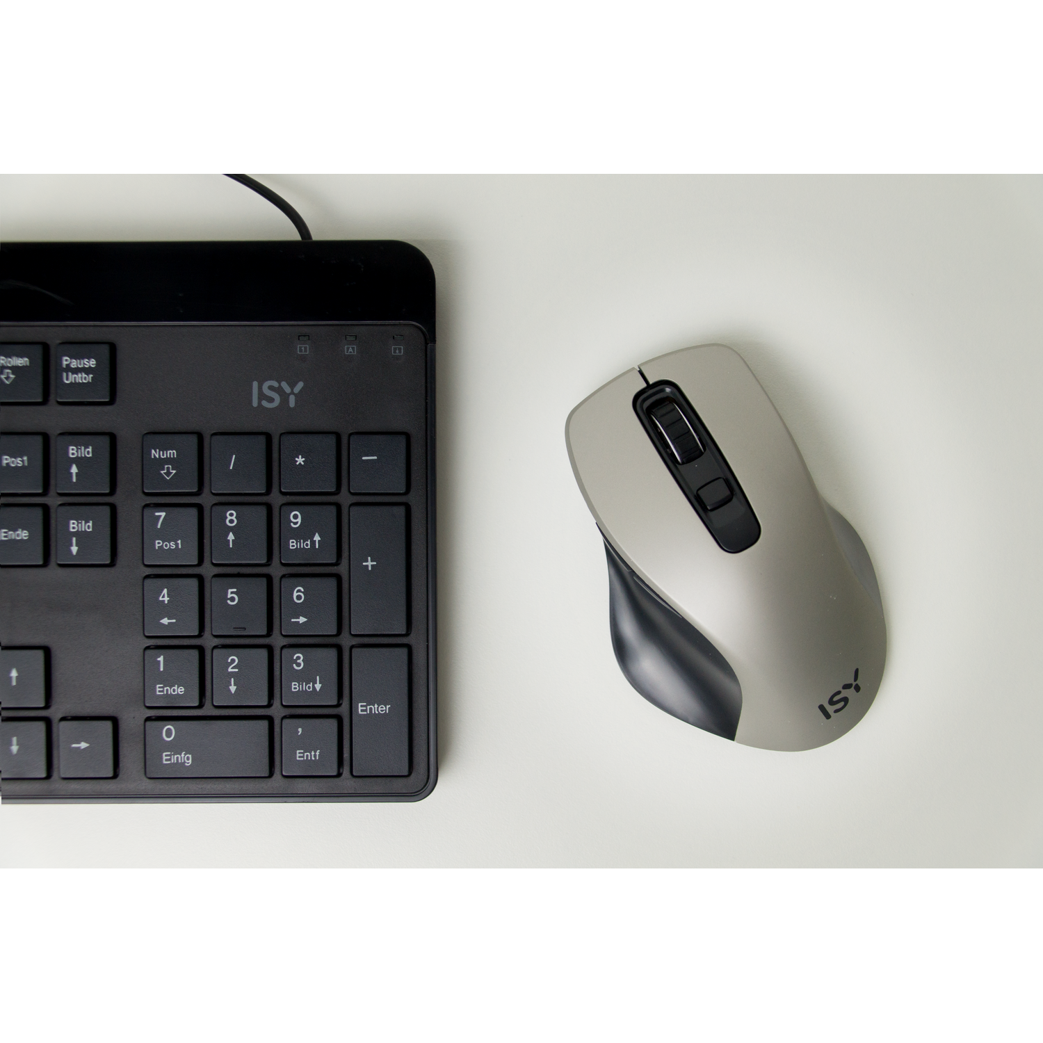 Keyboard and gray mouse on a white surface. The keyboard is black and ISY branded.