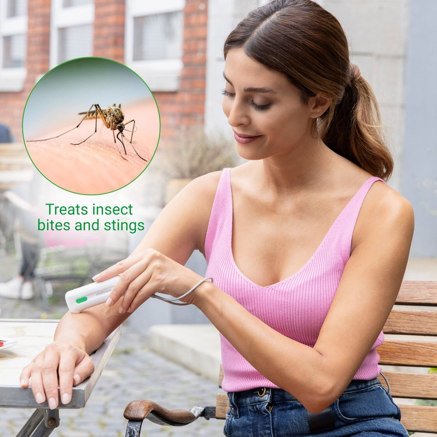 Woman treats insect bite with a device. A mosquito is in the circle.