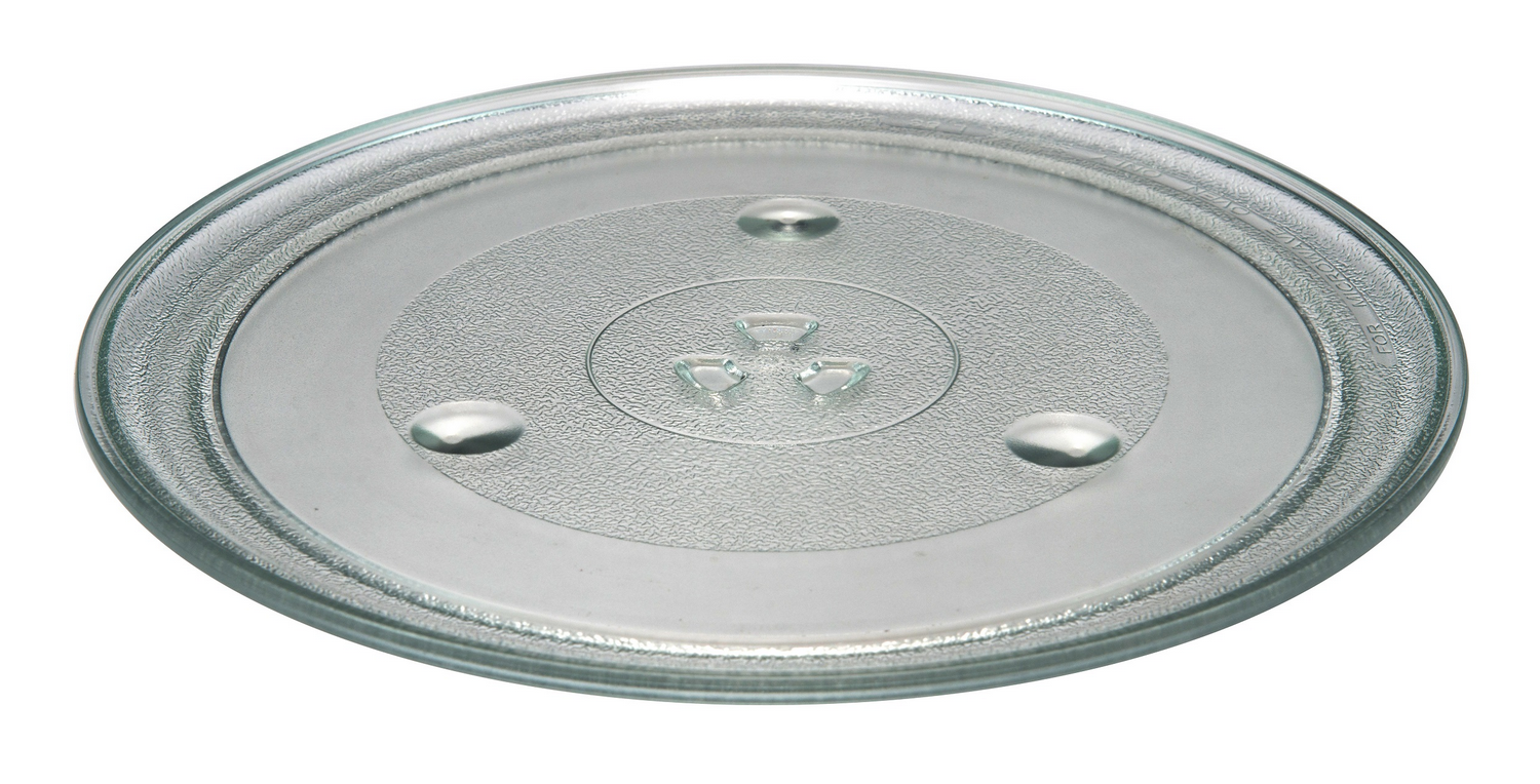 Un plato de microondas de vidrio transparente con tres pequeños pies elevados.