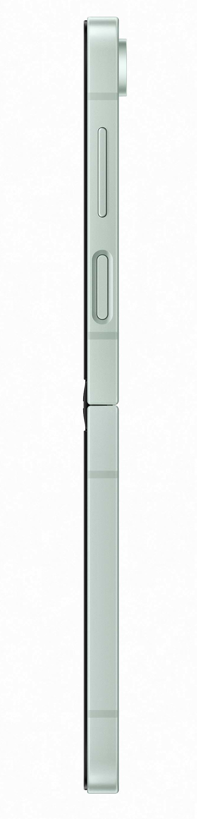 Widok z boku złożonego, jasnozielonego smartfona z aparatem na górze.