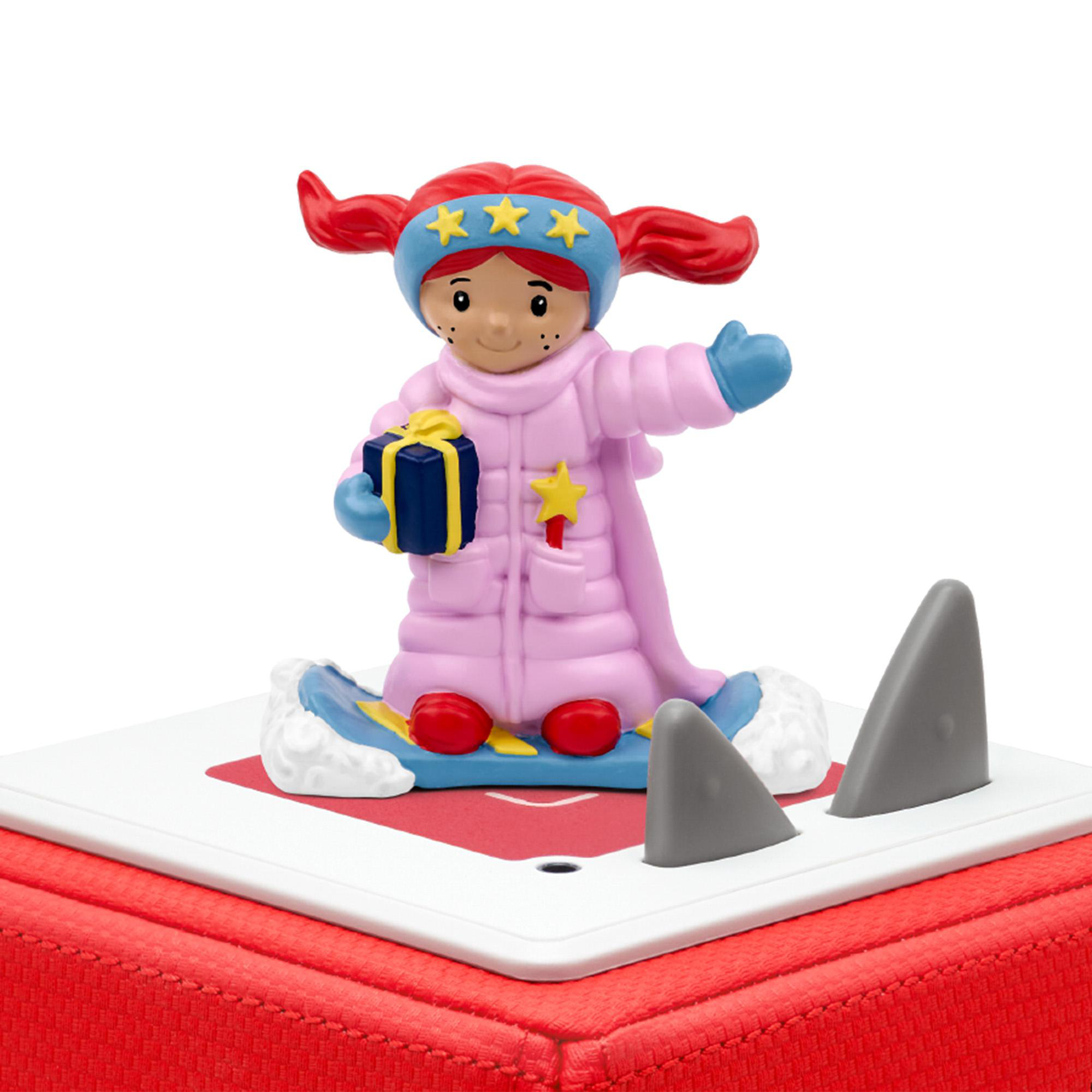 Eine Figur eines Mädchens in Winterkleidung auf einer roten Box. Haifischflossen sind sichtbar.