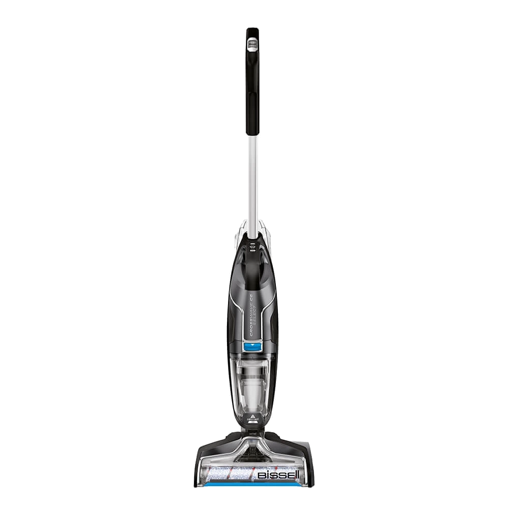 Aspiradora vertical, negra y plateada con depósito de agua transparente y logo 'bissell'.