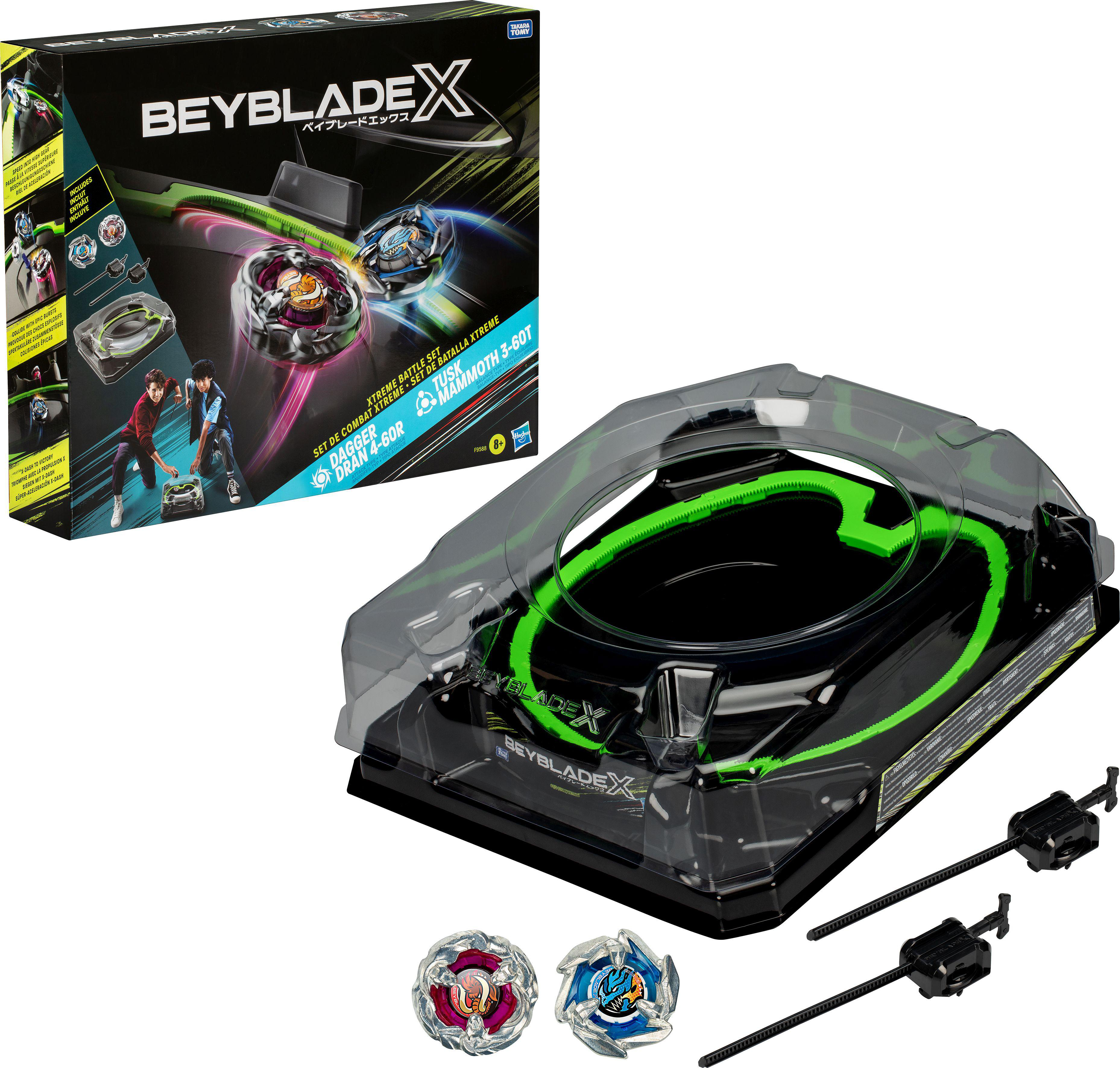 BeyBlade X Box-Set mit Arena, Startern und Beyblades. Zwei Beyblades sind sichtbar.