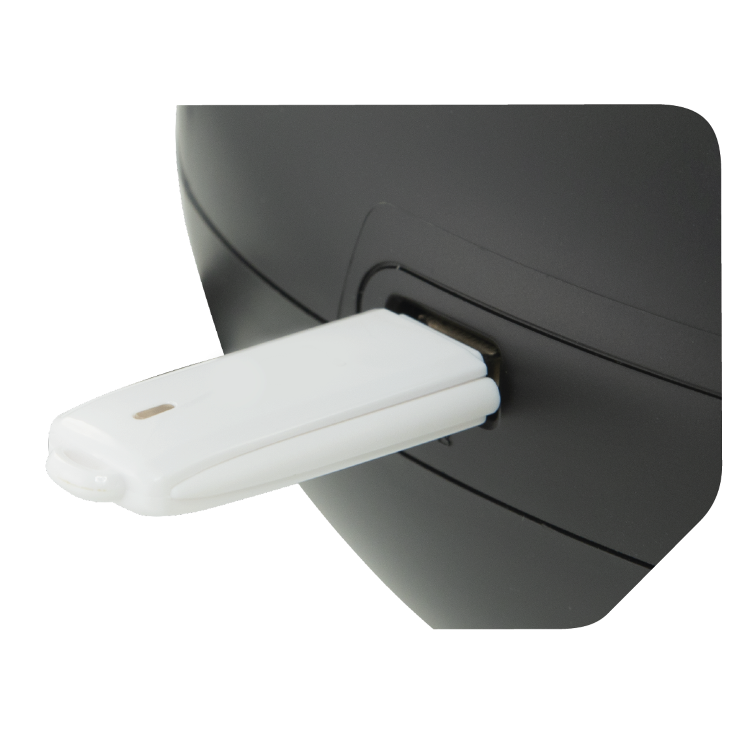 A white USB drive plugged into a black device, showing the connection point.
