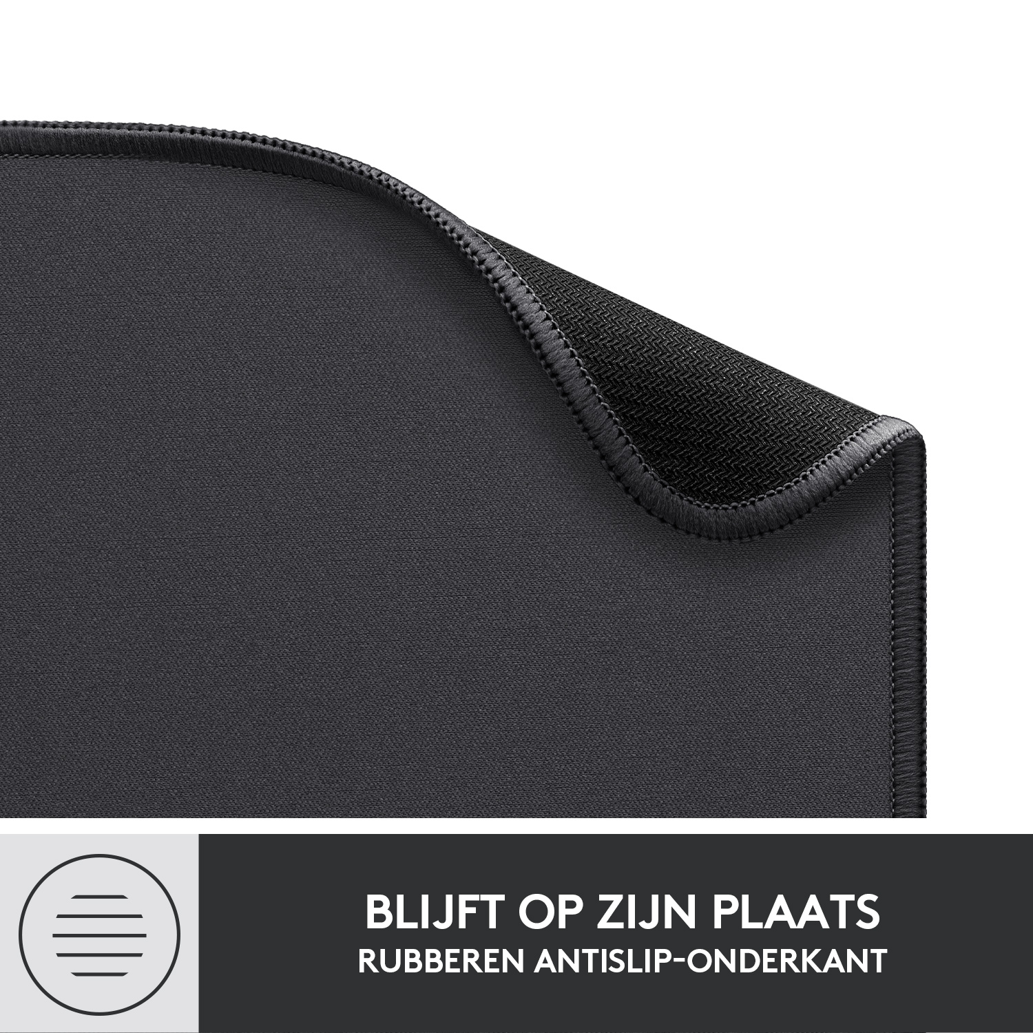 Black mouse pad, close-up. The text reads: Stays in place, rubber anti-slip bottom.