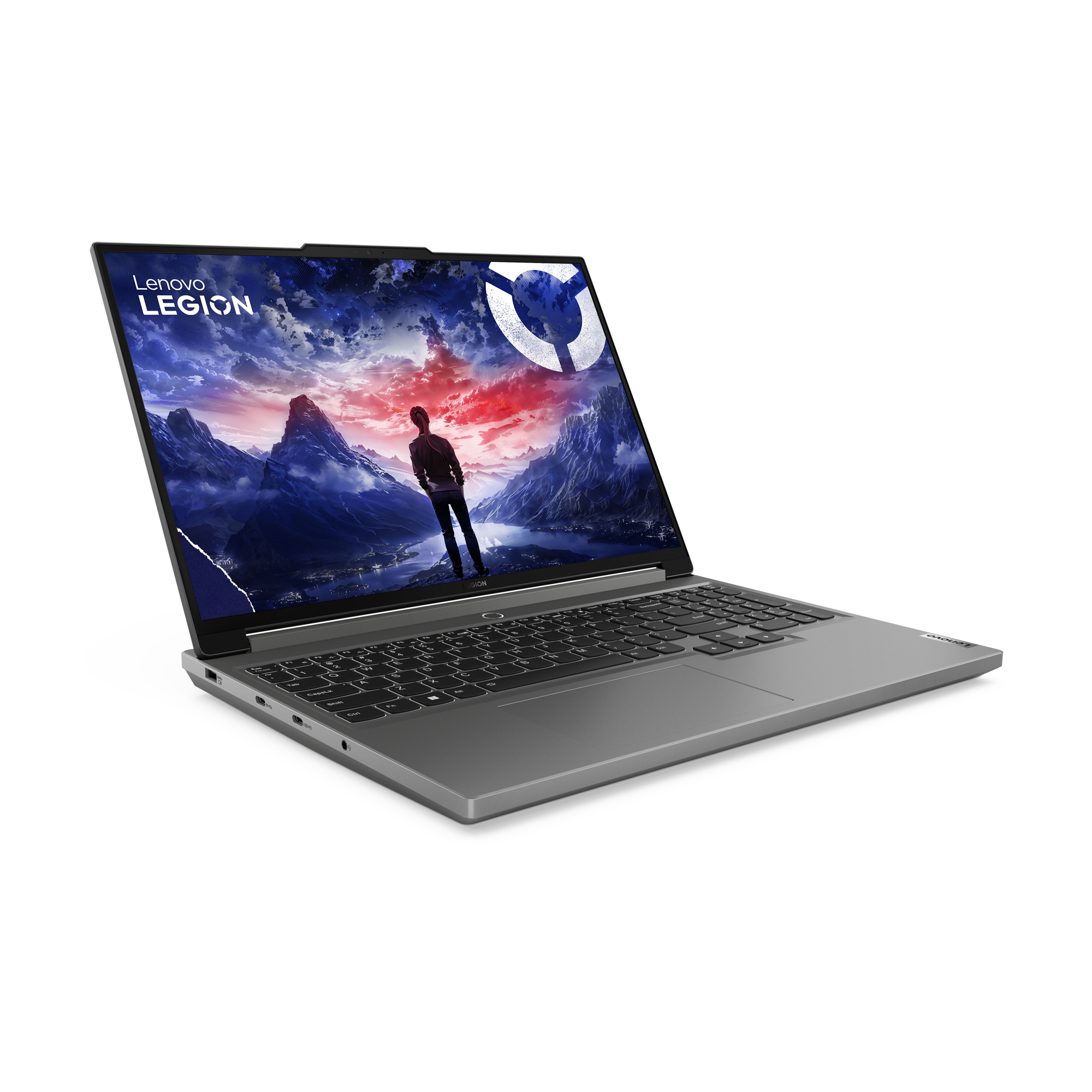 Ein silberner Lenovo Legion Laptop, der ein Spielbildschirm mit einer Person und Bergansicht zeigt.