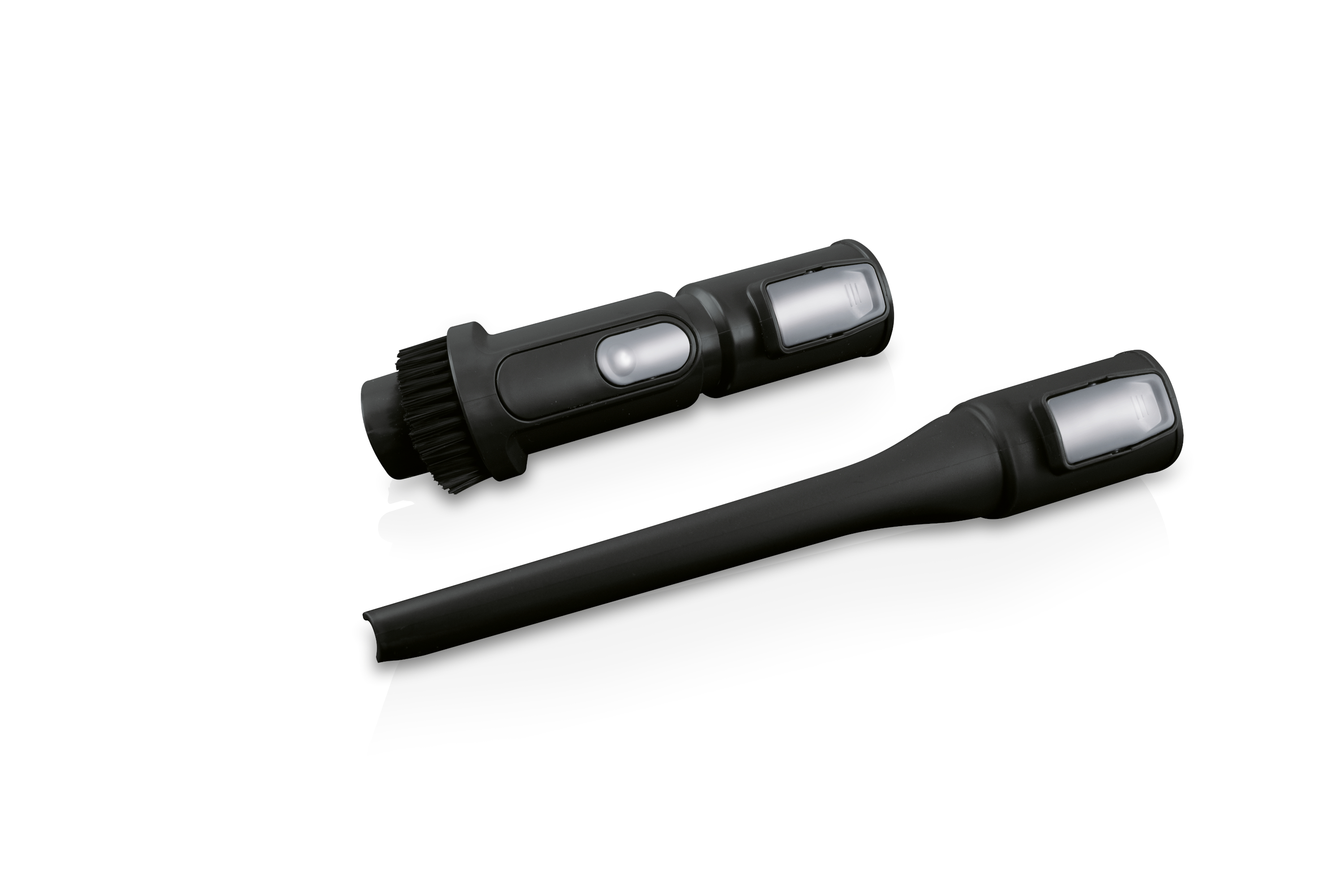 Dwa czarne nasadki do odkurzacza. Jedna ma szczotkę, druga to długa, wąska dysza.