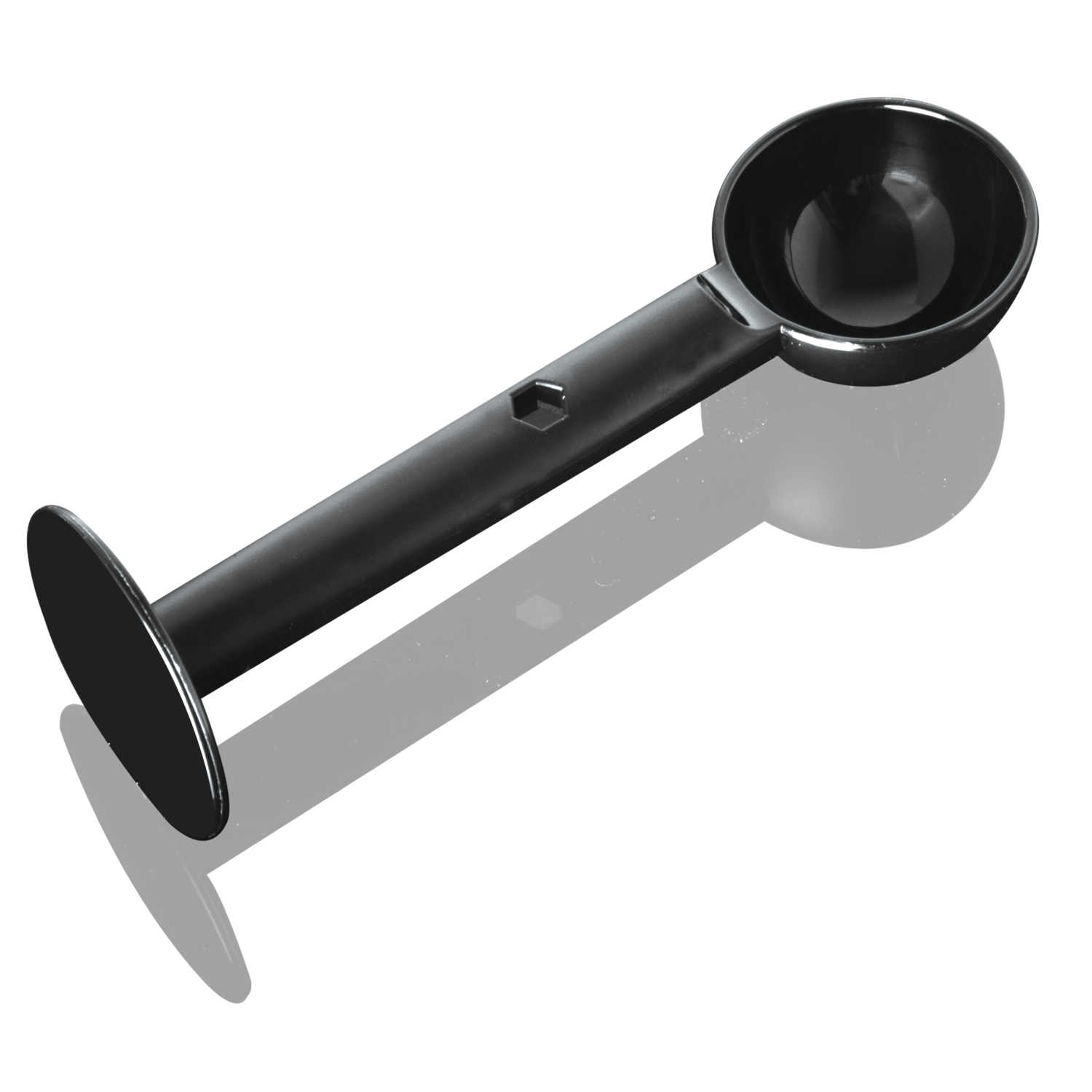 Black coffee measuring spoon. The spoon has two bowls and a handle, and is on a black surface.
