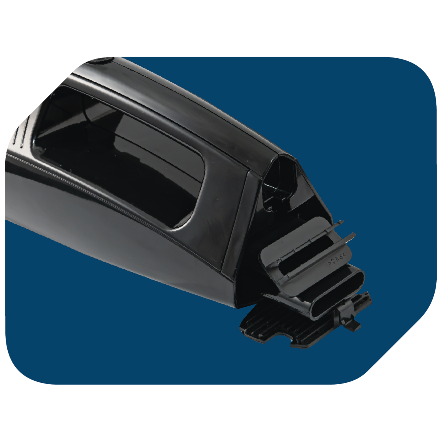 A close-up of a black plastic part, with a rectangular opening and a flap.