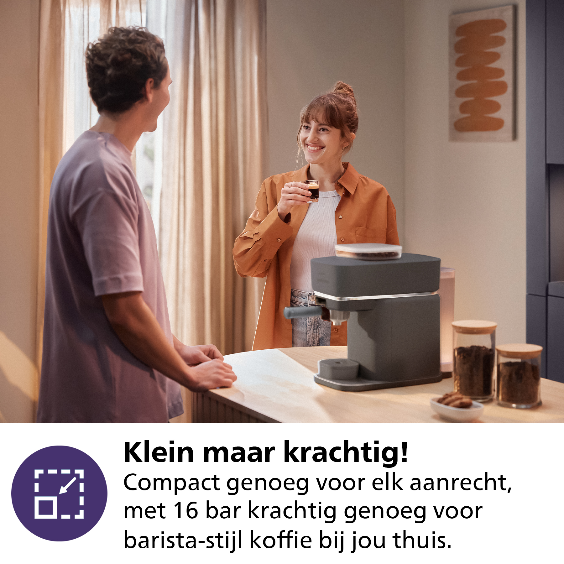 A man and woman with a coffee machine, with text: Small but powerful!
