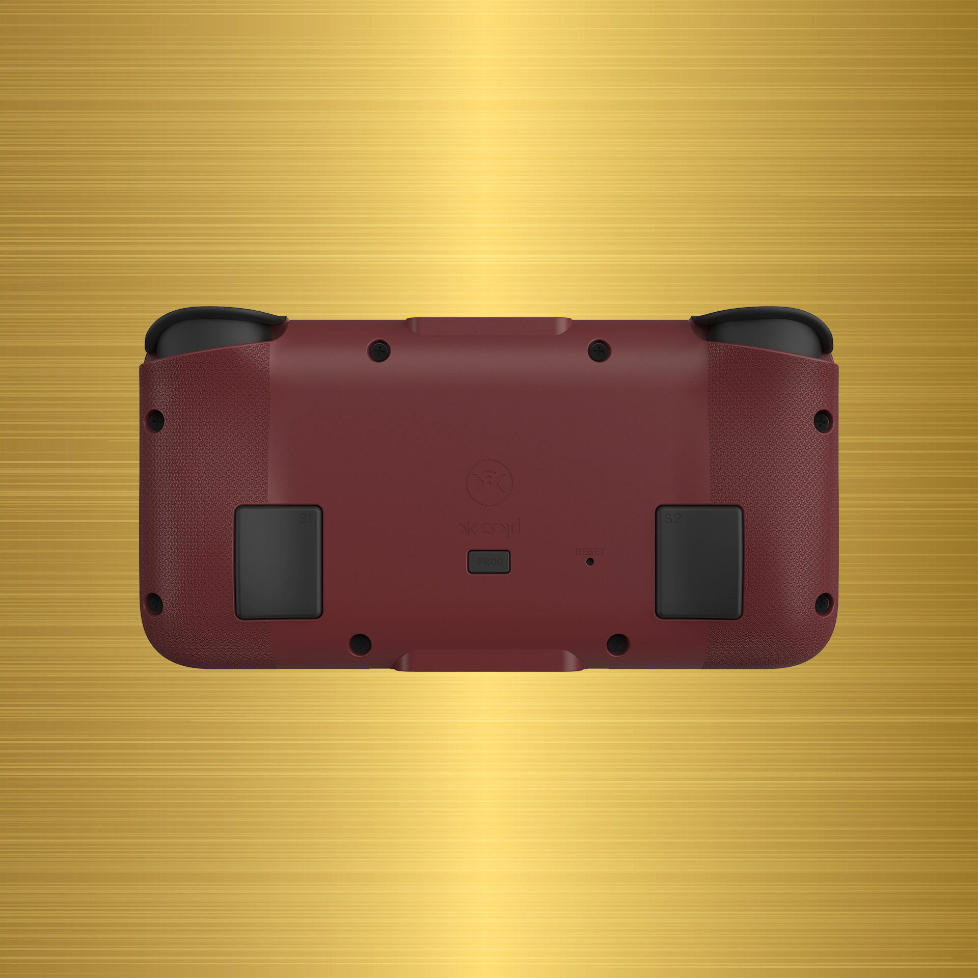 Eine weinrote Handheld-Konsole mit schwarzen Thumbsticks, vor goldenem Hintergrund.
