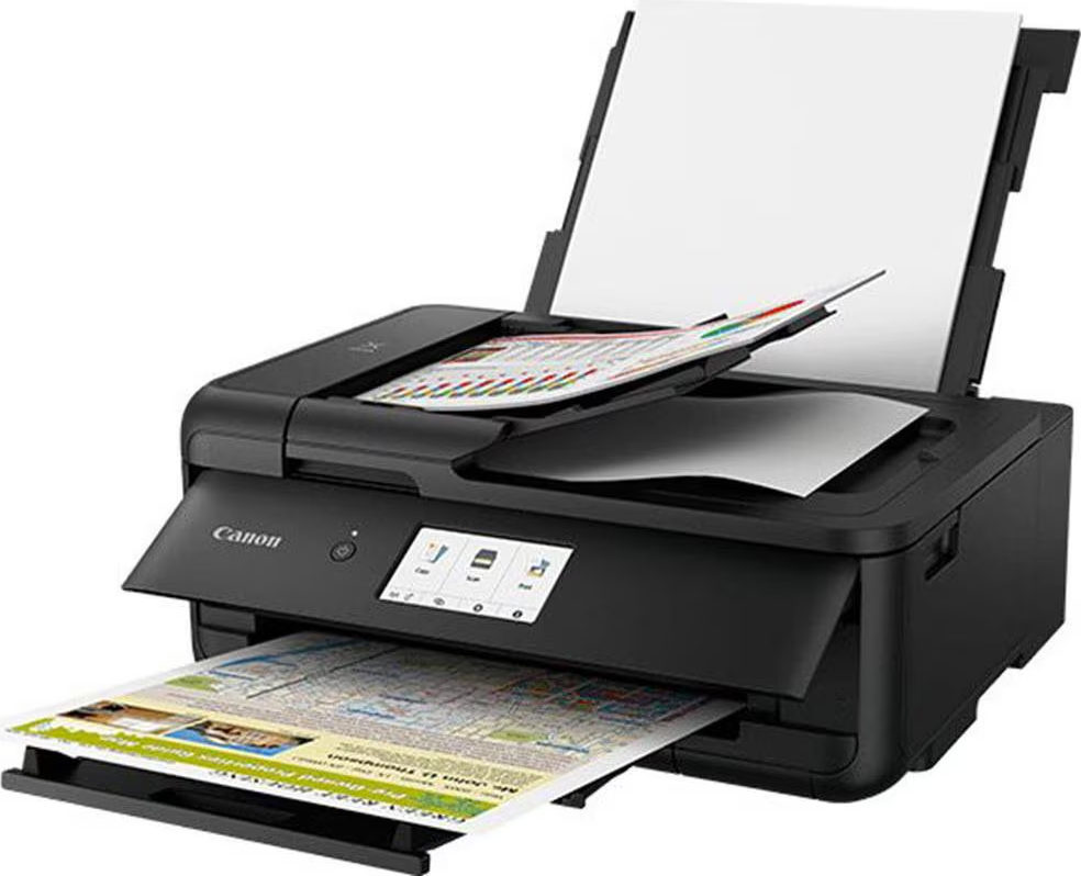 Schwarzer Canon Drucker, der Papier druckt. Papierausgabe vorne, Papiereingabe hinten, Display.