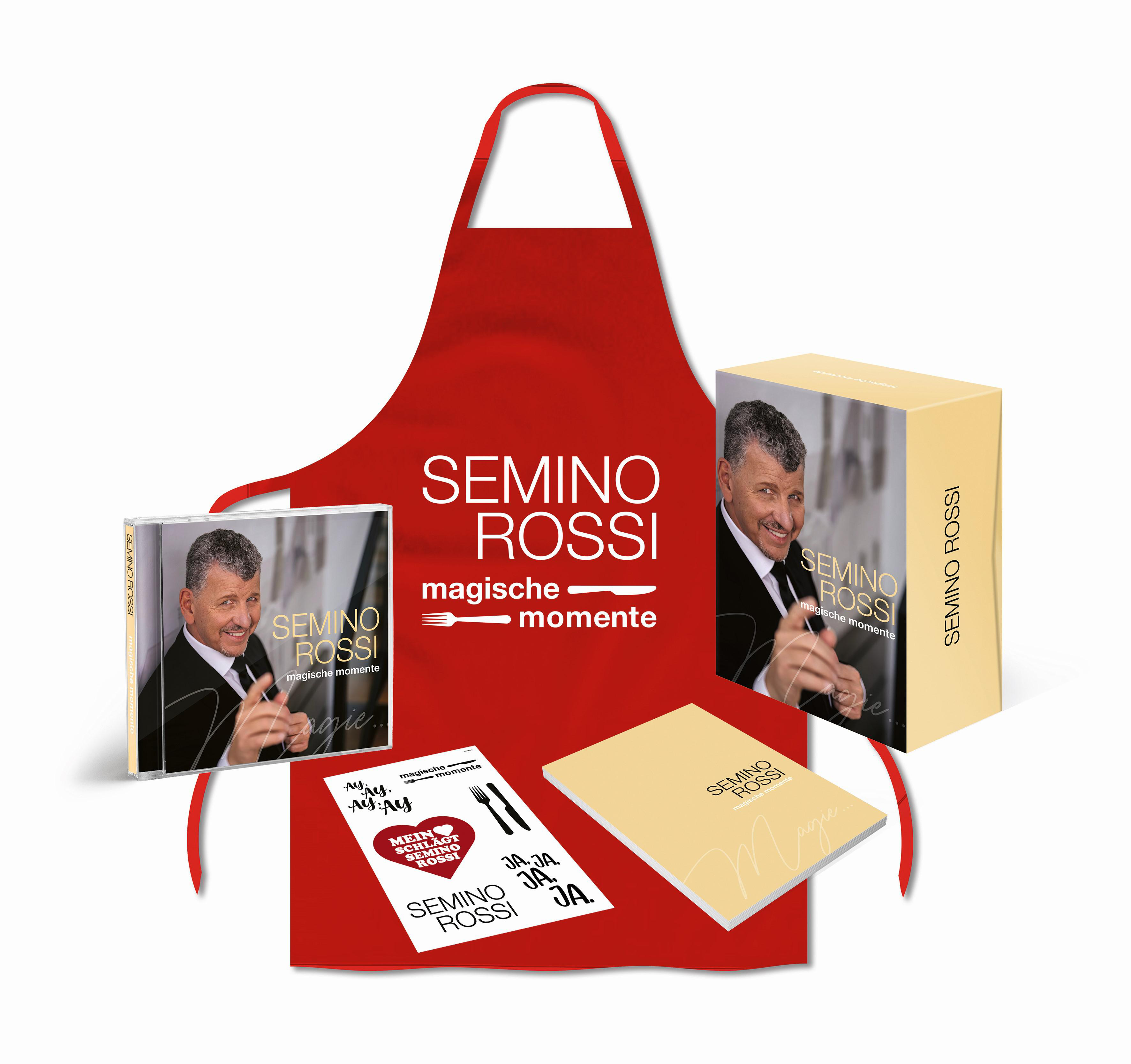 Rote Schürze, CD, Buch und Box mit Semino Rossis Bild und den Worten „magische momente“.