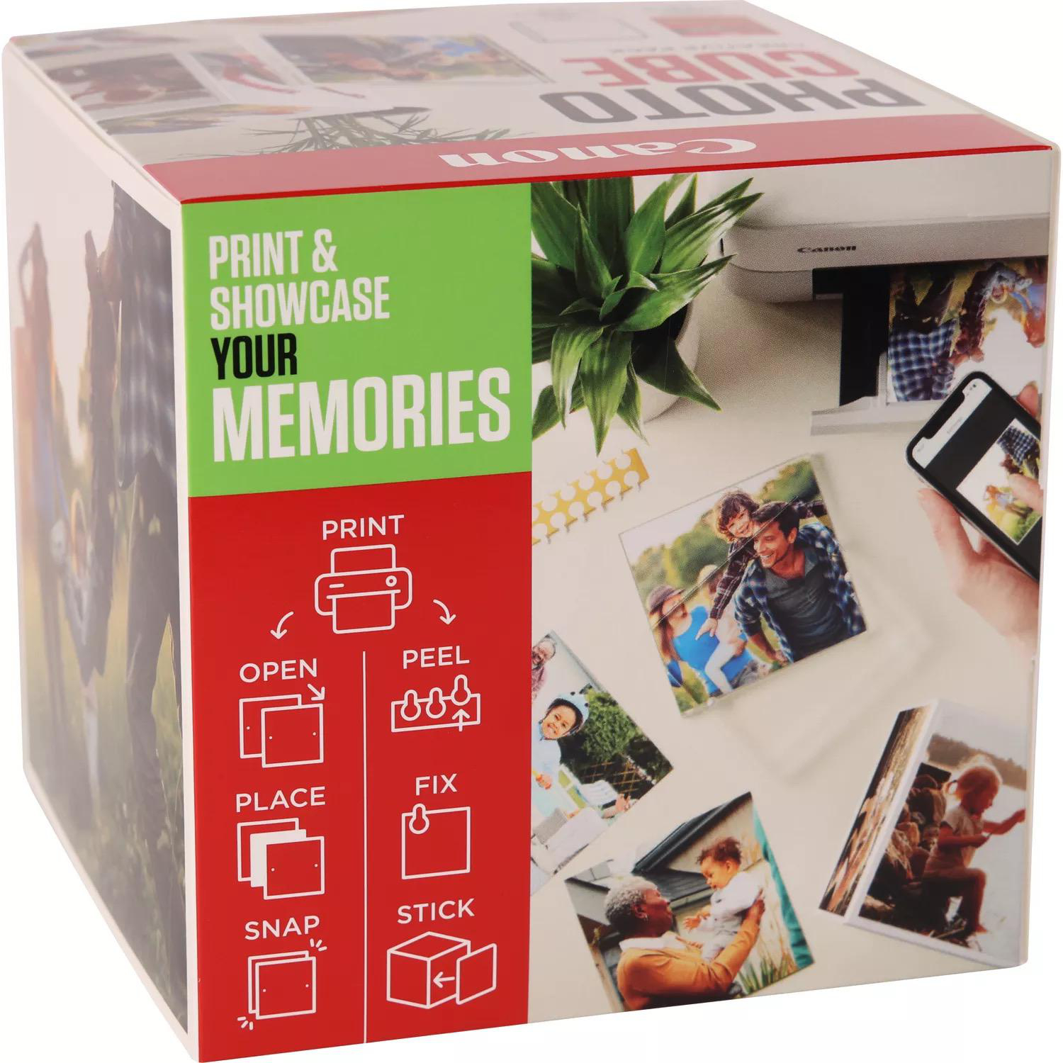 Canon Photo Cube-Box mit Bildern von Fotos und Anweisungen. Weißer Hintergrund.