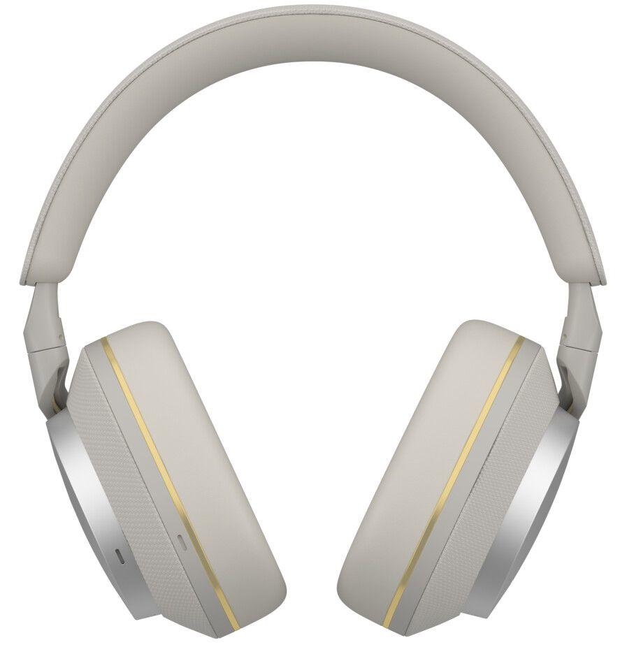 Beżowe słuchawki ze złotymi akcentami, umieszczone na białym tle.