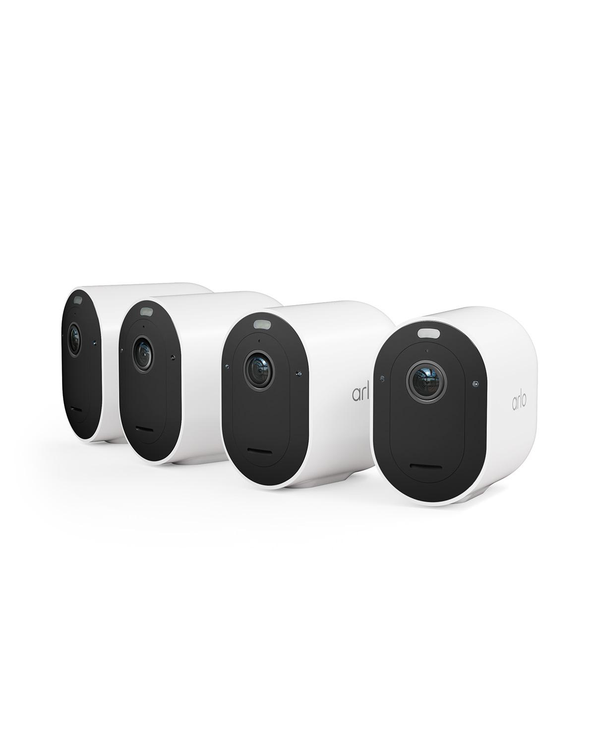 Vier weiße Arlo-Sicherheitskameras sind vor weißem Hintergrund aufgereiht.