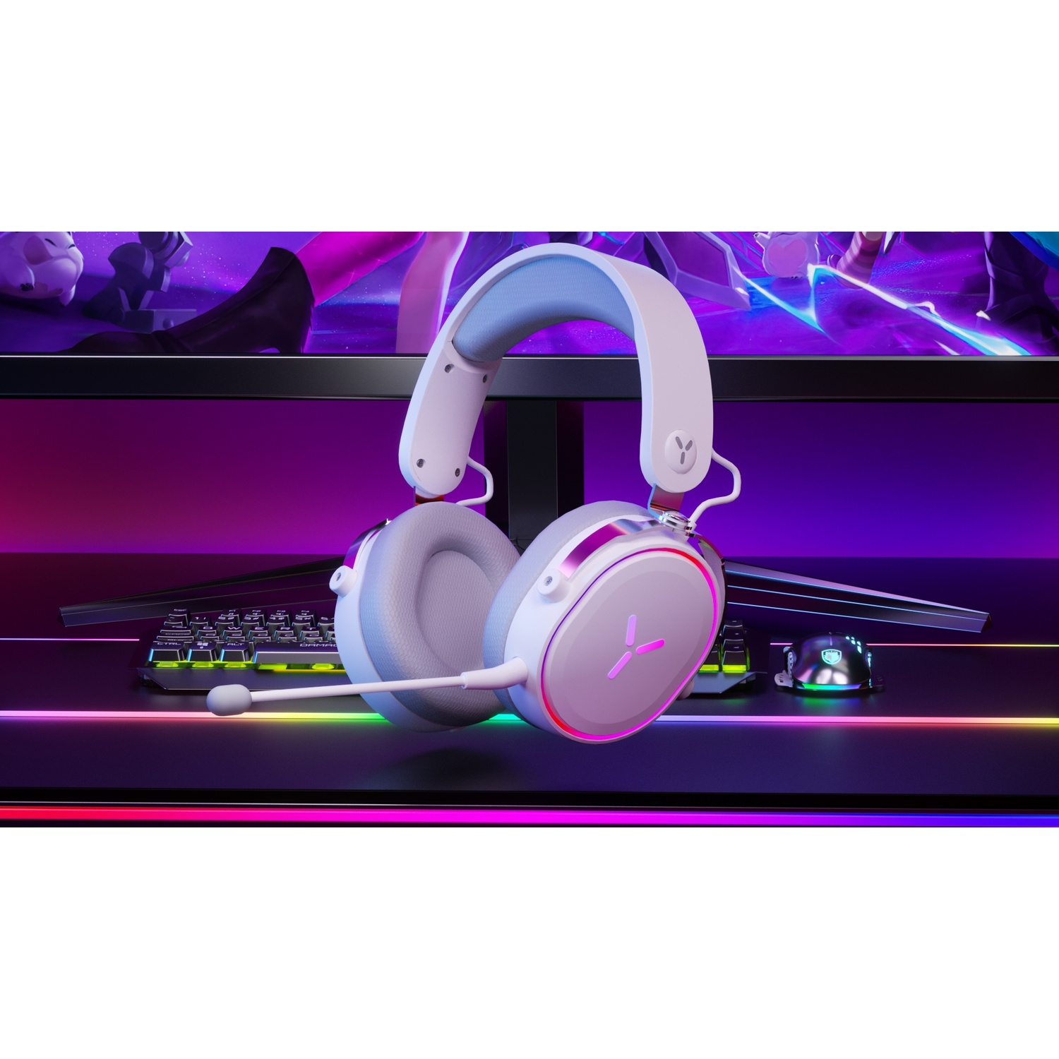 White and gray gaming headphones on a desk. Keyboard and mouse are visible.