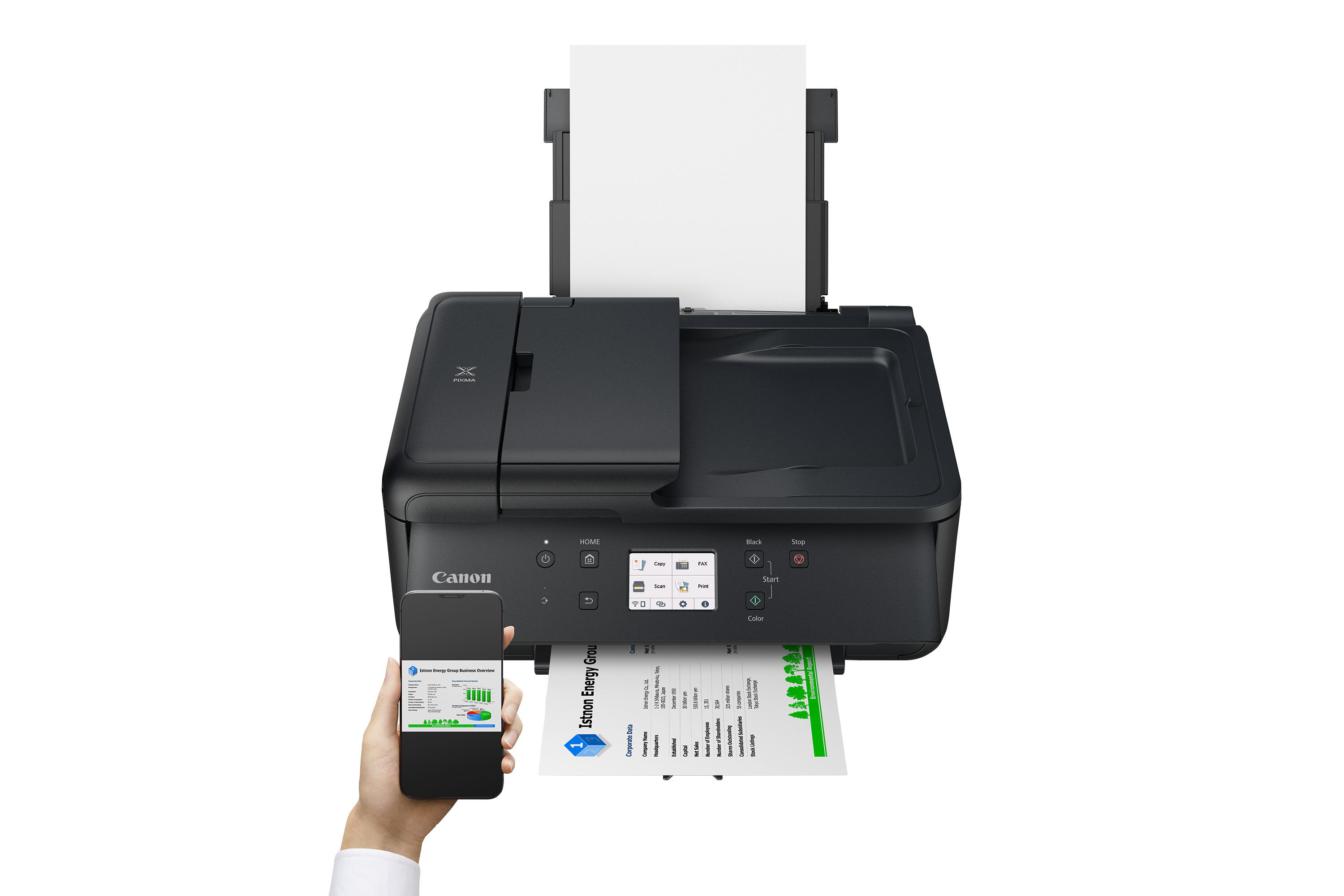 Canon-Drucker druckt Dokument. Hand hält Smartphone mit Diagramm.