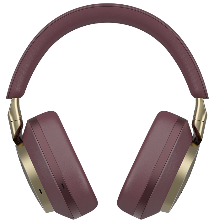 Czerwone i złote słuchawki na czarnym tle.