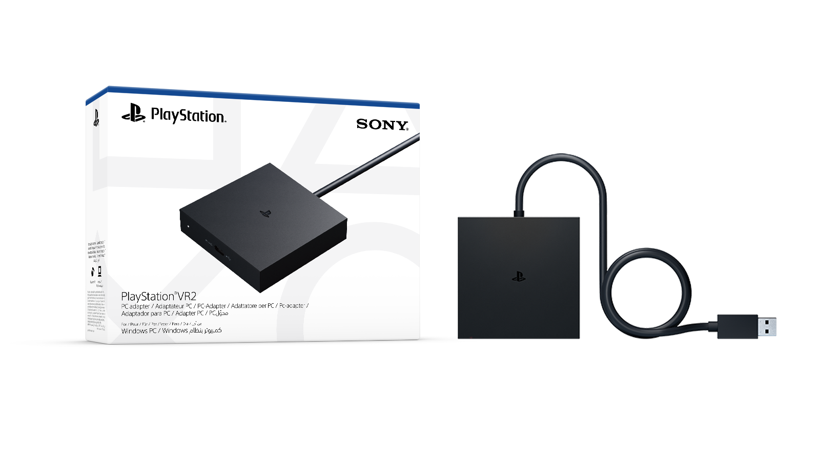 PlayStation VR2 with adapter and box on a black background. Black square device.