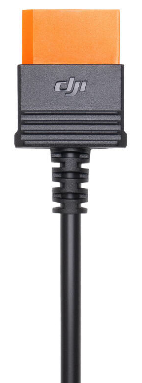 Czarny kabel z pomarańczowym złączem jest podłączony do czarnej prostokątnej podstawy z logo DJI.