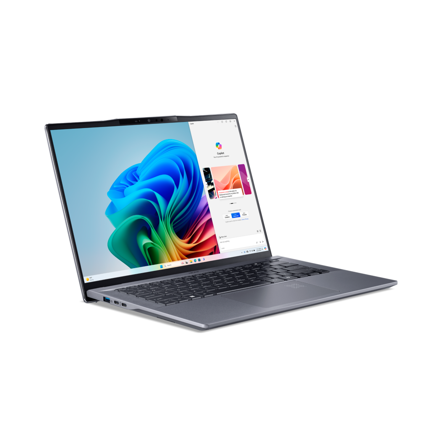 A silver laptop with a colorful wallpaper on its screen, open on a black background.