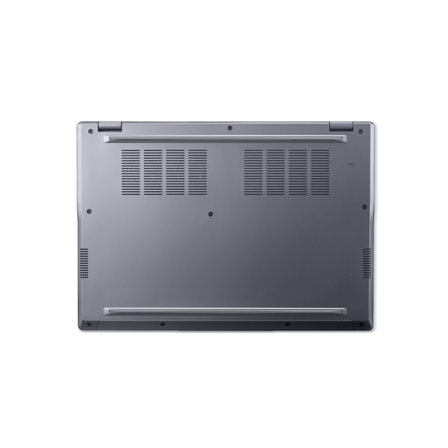The bottom of a silver laptop with ventilation holes and rubber feet on a black background.