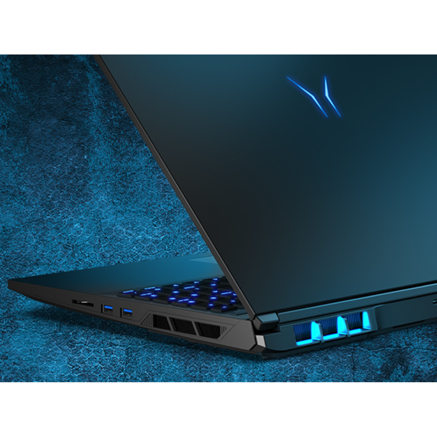 Black gaming laptop with blue backlit keyboard and vents, back view, on blue surface.
